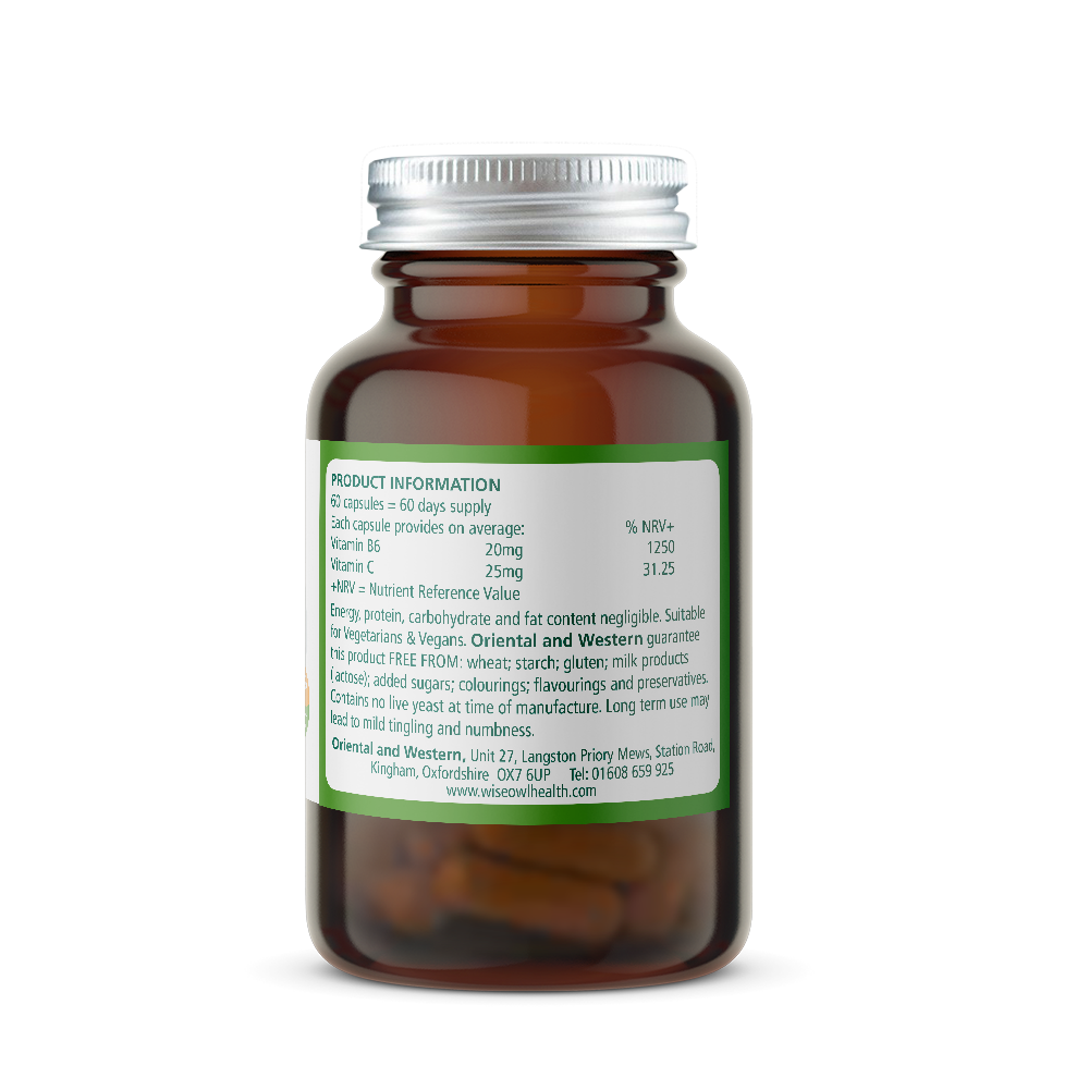 Amber glass supplement bottle with a green label on a white background