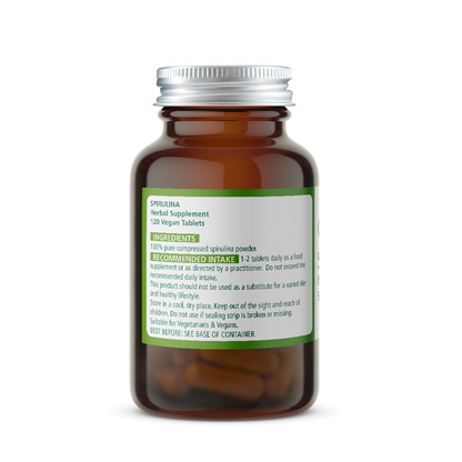 Amber glass spirulina supplement bottle with a silver cap on a white background