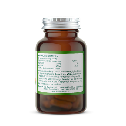 Amber glass supplement bottle with a green label on a white background